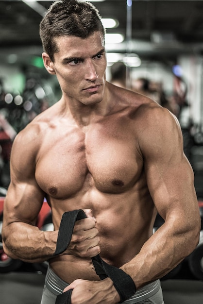 Confident athlete man in gym