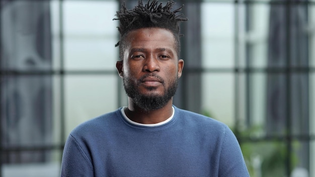 Confident black business man looking at camera with serious expression