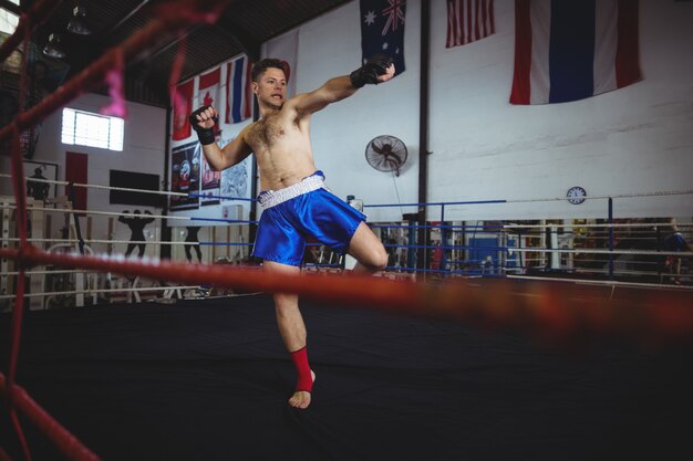 Confident boxer practicing a boxing