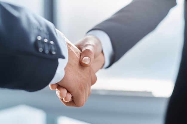 Confident business handshake concept of cooperation and partnership