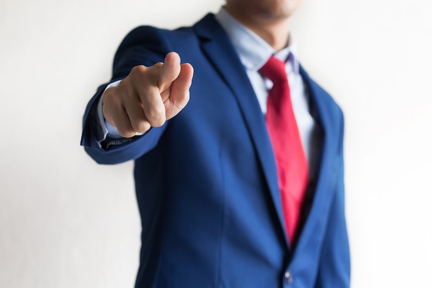 Confident business manager pointing at camera 