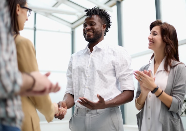 confident business partners meet in an office building and talk