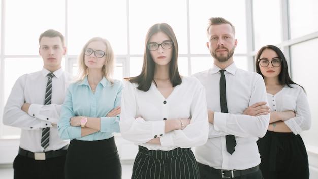 confident business team on the background of a bright office.