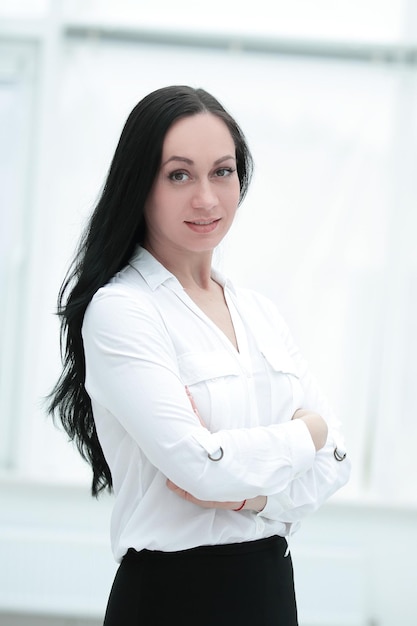 Confident business woman on the background of office window