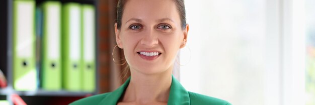 Confident business women holding financial documents and smiling in office room financial