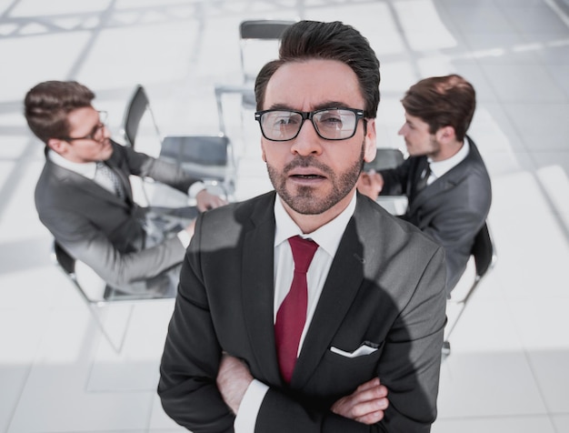 Confident businessman on the background of the offic