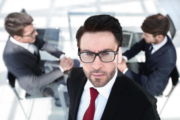 Confident businessman on the background of the office