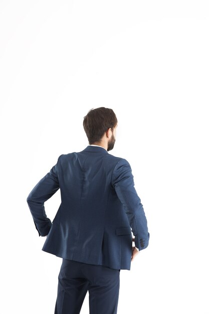 confident businessman in a business suit standing turned