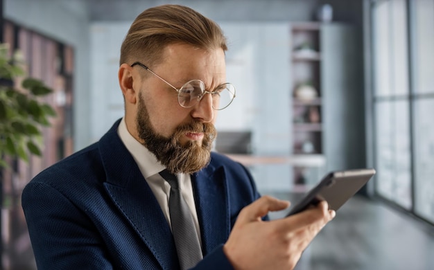 Confident businessman in eyeglasses and stylish