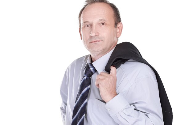 Confident businessman holding a jacket over his shoulder