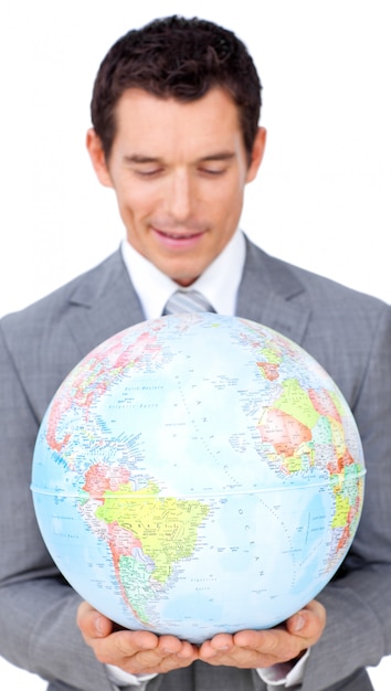 Confident businessman holding a terrestrial globe 