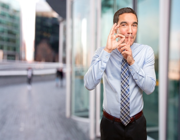 Confident businessman keeping a secret