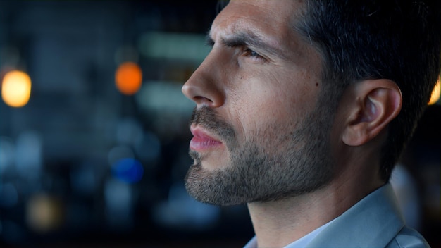 Confident businessman looking distance closeup Serious professional contemplate