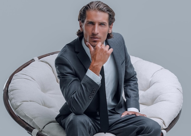 Confident businessman sitting in chair