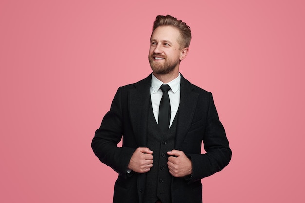 Confident businessman in suit in studio