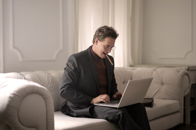 Confident businessman with a laptop