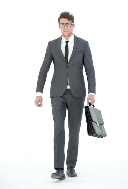 Confident businessman with leather briefcase goes forward