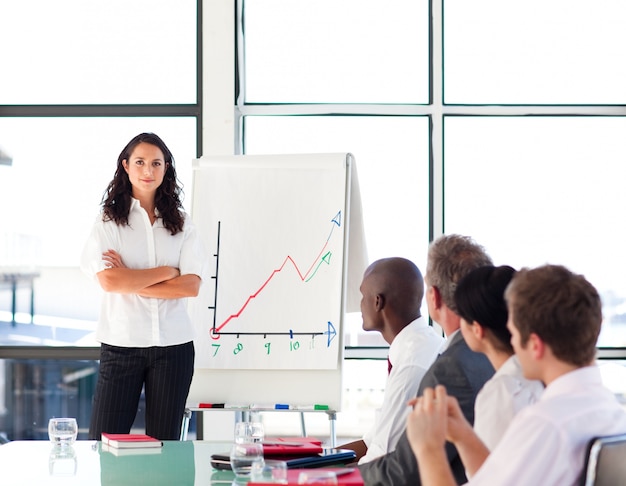 Confident businesswoman in a presentation with folded arms