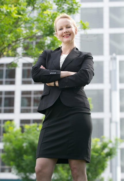 Confident businesswoman smiling outdoors