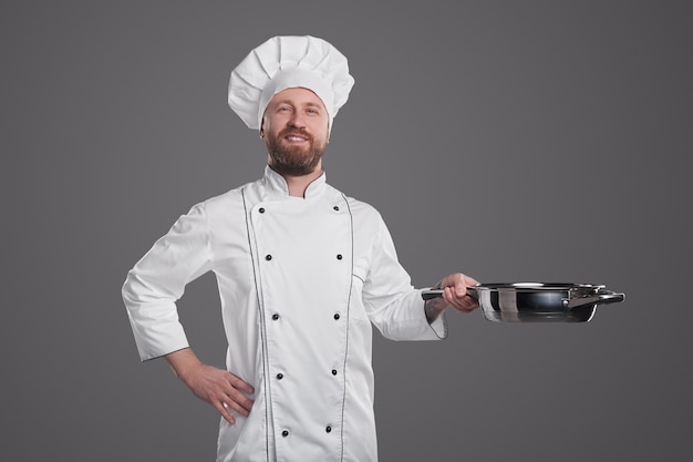 confident chef with frying pan