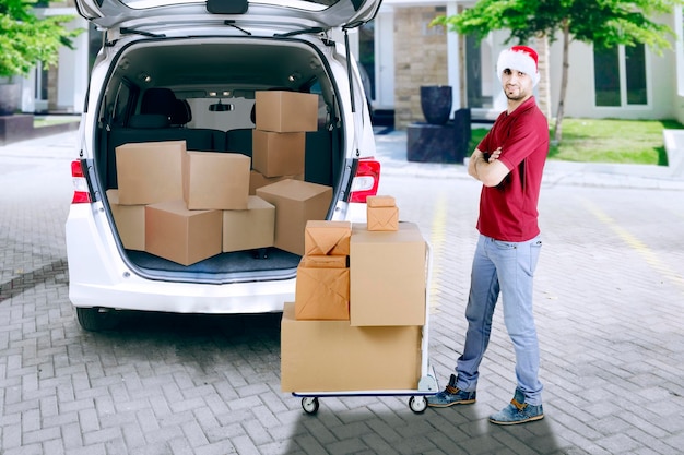 Confident delivery man with package