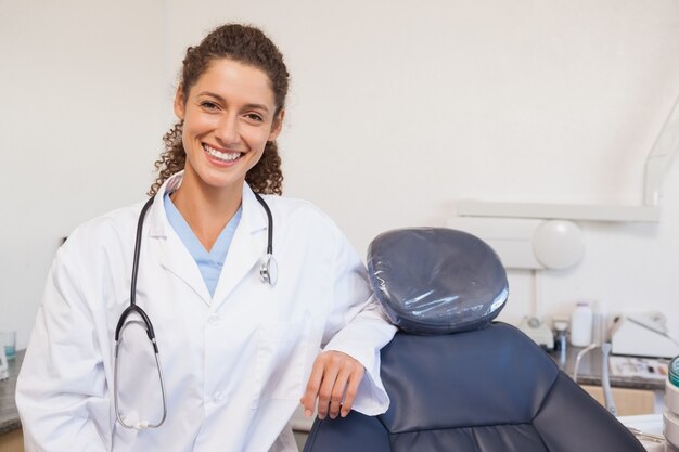 Confident dentist smiling at the camera 