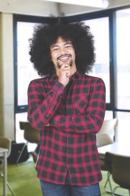 Confident designer student smiling in a classroom