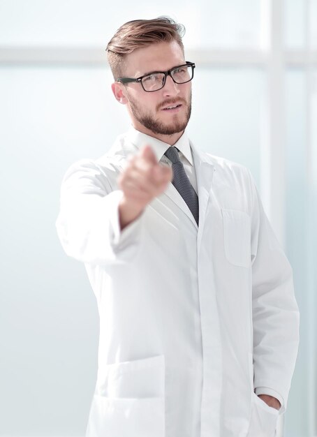 Confident doctor therapist pointing at you