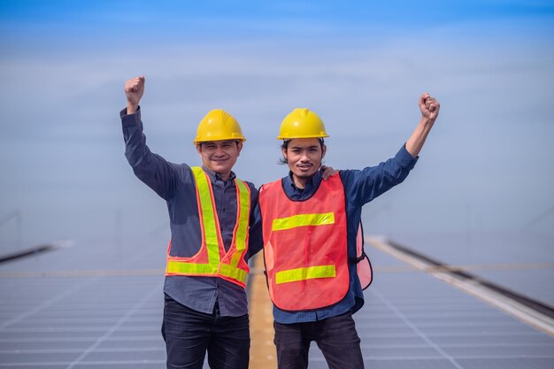 Confident Engineer standing check on Solar power energy at rooftop factory