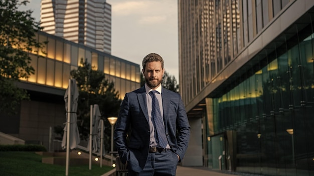 Confident entrepreneur in suit outside the office business fashion