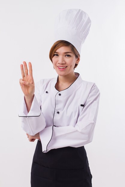 Confident female chef on a white background