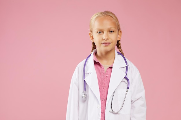 Confident girl in lab coat