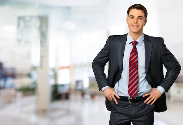 Confident handsome businessman isolated on white