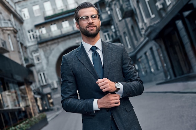 Confident and handsome full length of young man in full suit sm