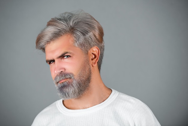 Confident and handsome man Close up face of a young man without emotions Closeup portrait of a confident middle eastern businessman