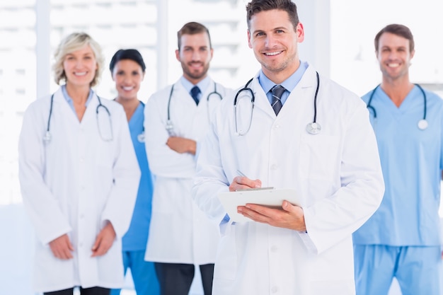 Confident happy group of doctors at medical office