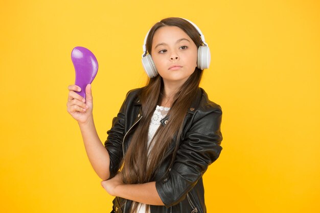 Confident in her style child listen rock music school radio dj hipster urban style girl kid in headset small girl sing song imagine you are pop star singing karaoke singer leather jacket