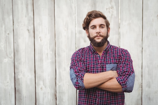 Confident hipster with arms crossed