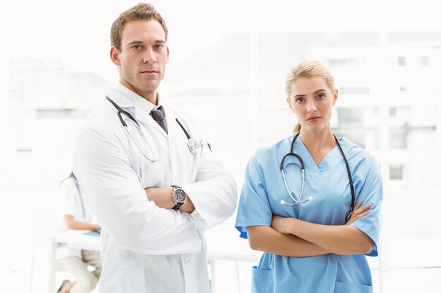 Confident male and female doctors