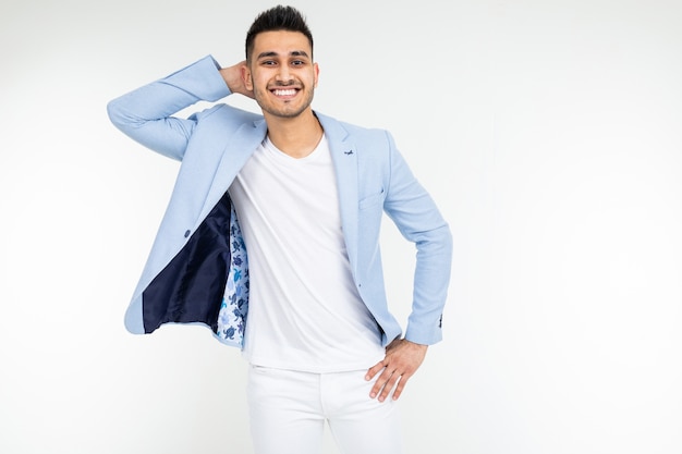 Confident man in a blue jacket posing