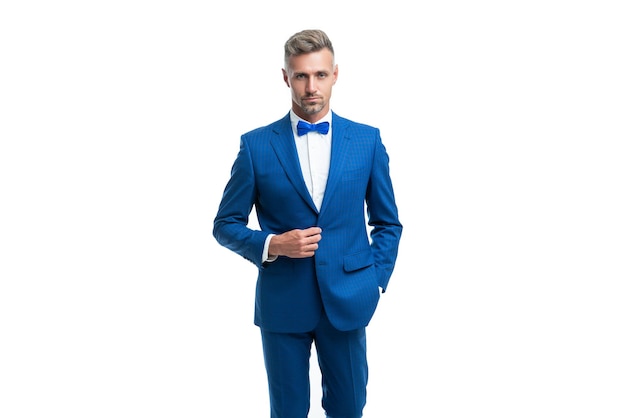 Confident man bridegroom in blue rich tux bow isolated on white background