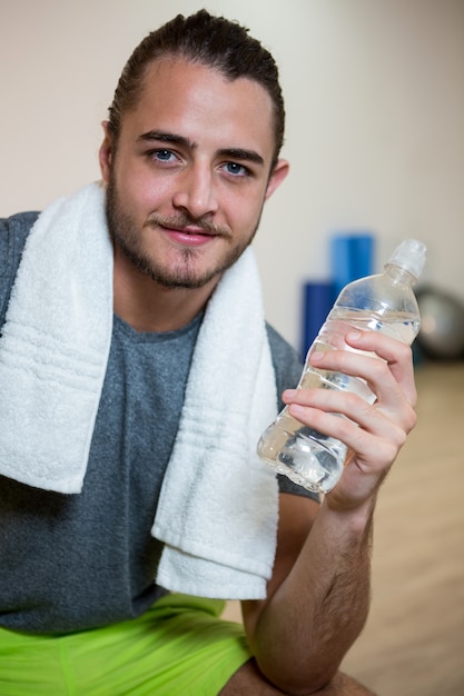  confident man holding water bottle