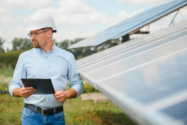 Confident man and power solar station