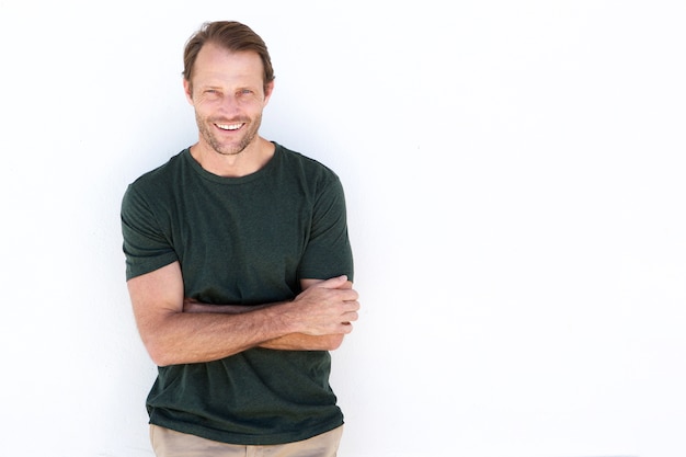 Confident man smiling against white background 