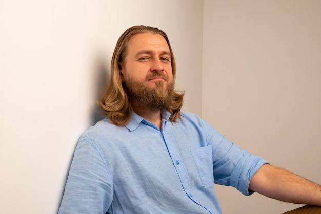 Confident man wearing knit hat by wall