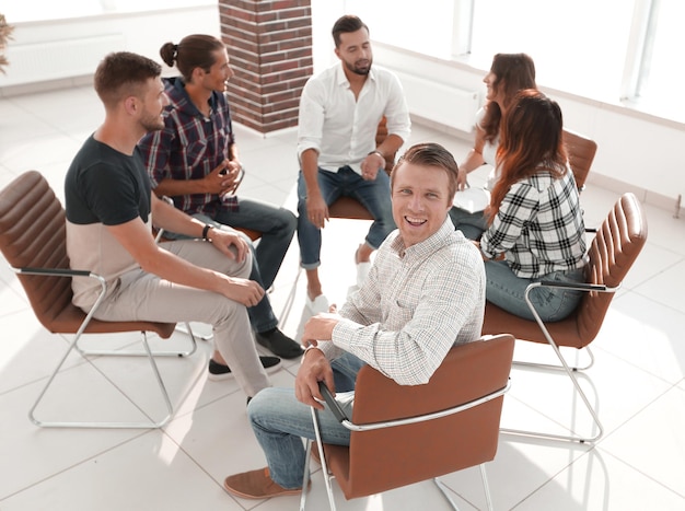 Confident manager sitting at the workshop