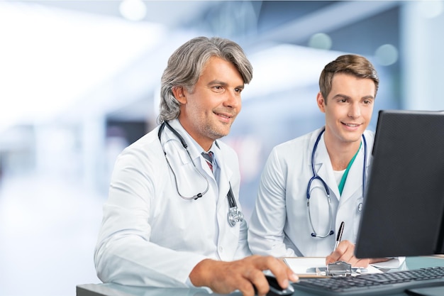 Confident Medical team at hospital with laptop