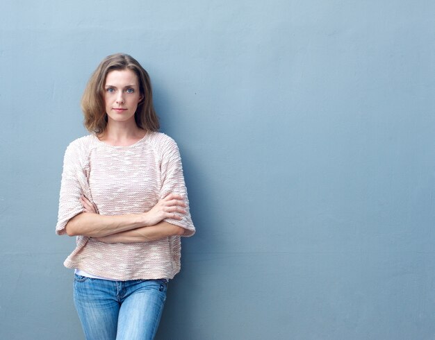 Confident mid adult woman posing with arms crossed