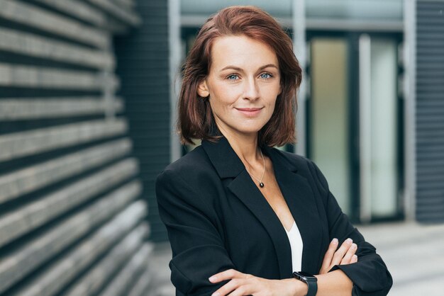 Confident middleaged woman with crossed arms l