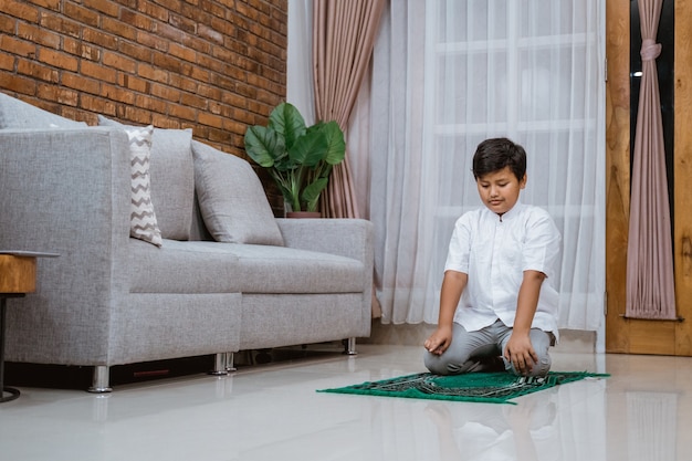 Confident Muslim child in a Koko shirt